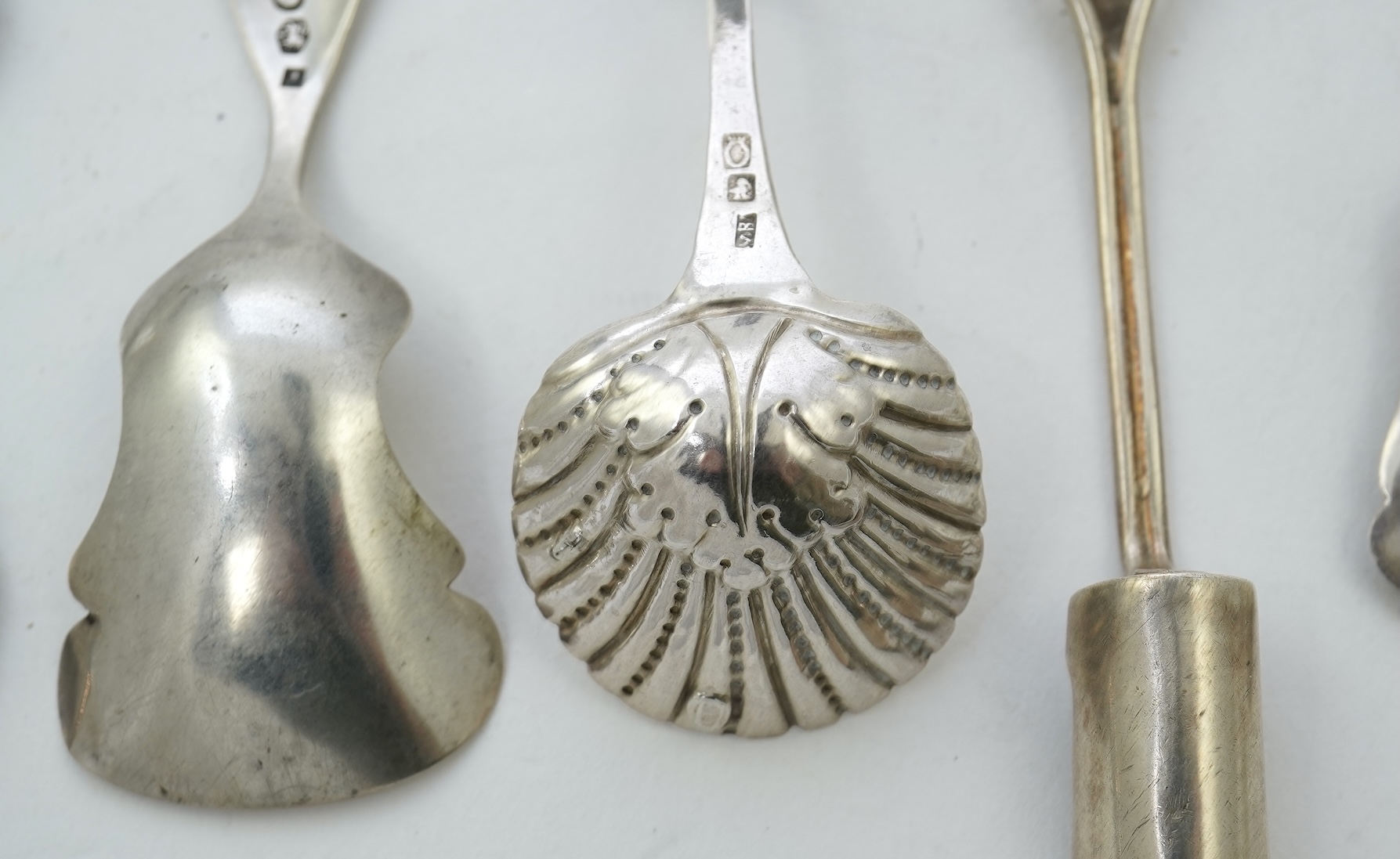 A collection of seventeen mainly 19th century Dutch white metal caddy spoons